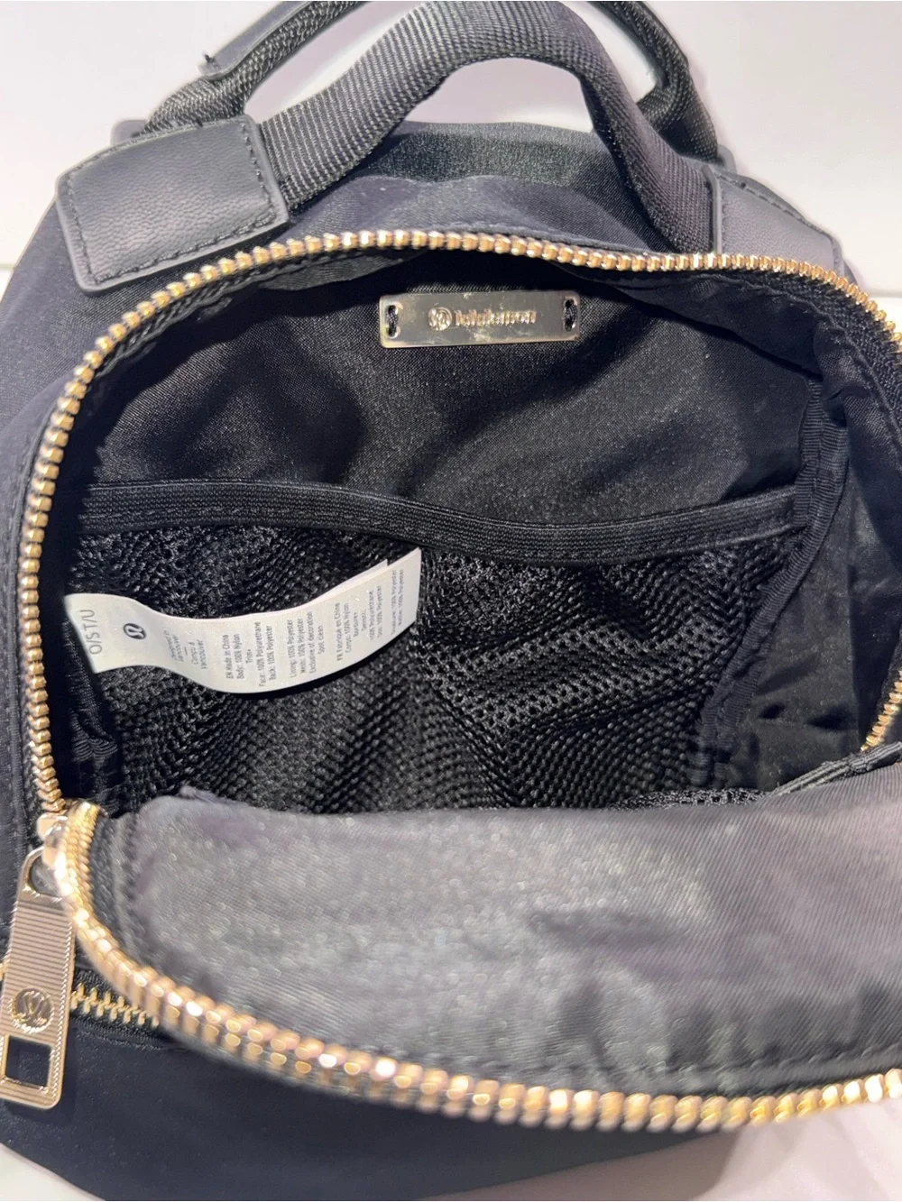 lululemon athletica Black Mini Backpack with Gold Zippers
